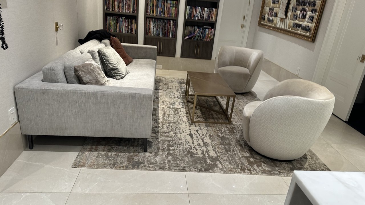 A wider view of the living room rug