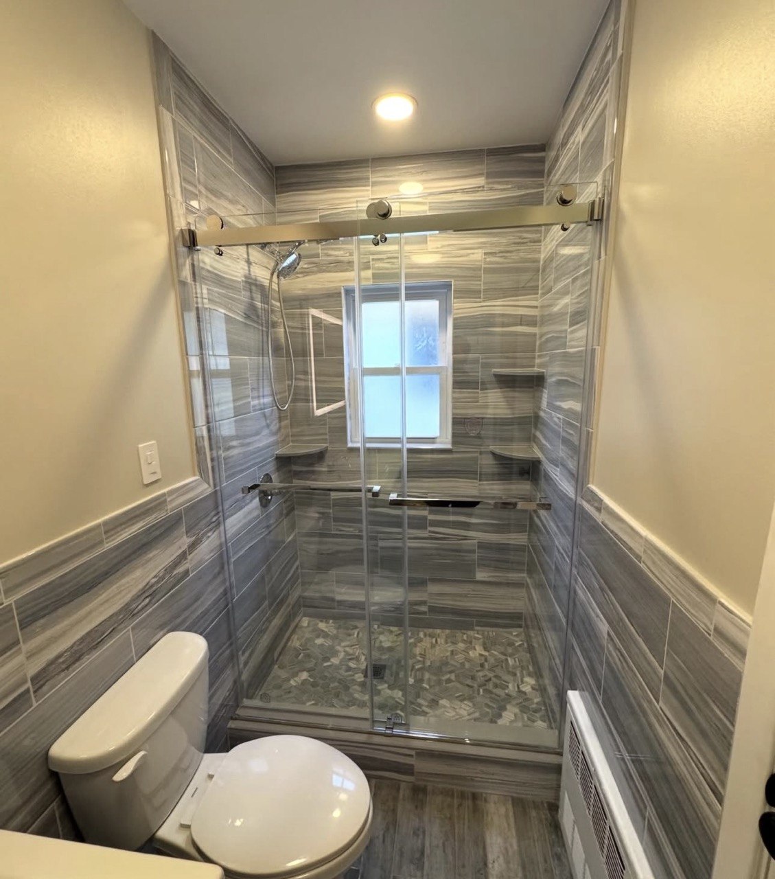 Bathroom with a glass shower enclosure.