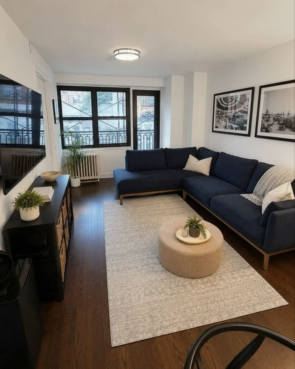 Living room with a blue sectional sofa.