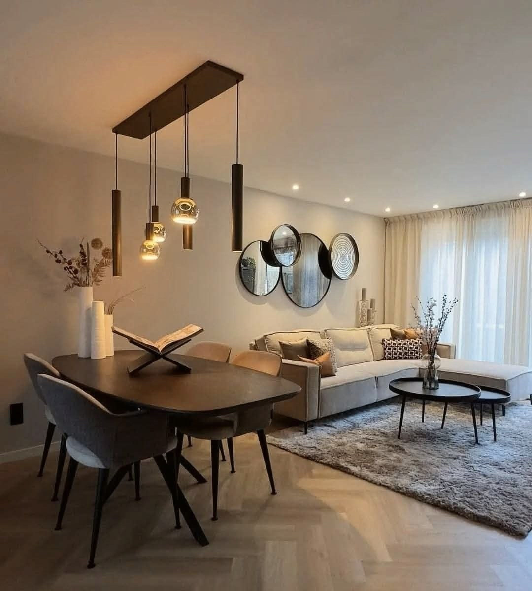 Living and dining room with pendant lights.